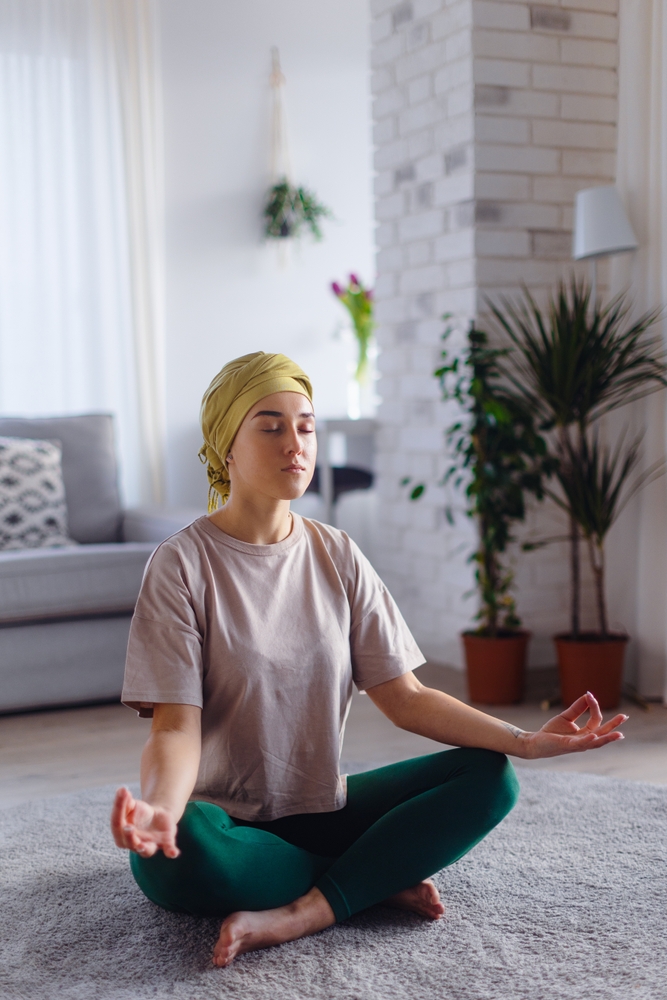 Young,Woman,With,Cancer,Taking,Yoga,And,Meditating,In,Her