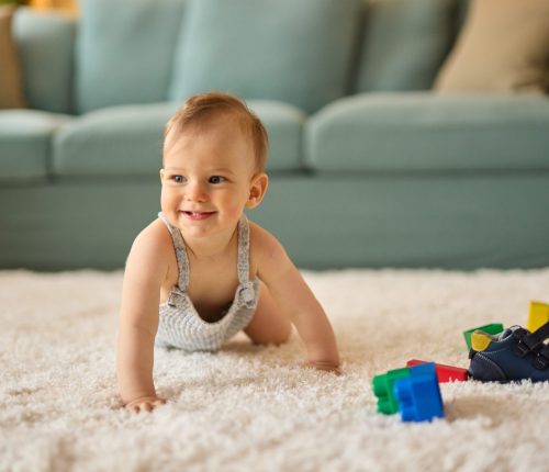 Portrait,Of,A,Cute,Crawling,Baby,Boy,At,Home