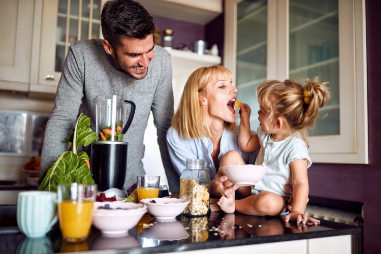 Girl,Feeding,Her,Mother,In,The,Morning,In,Kitchen Girl,Feeding,Her,Mother,In,The,Morning,In,Kitchen