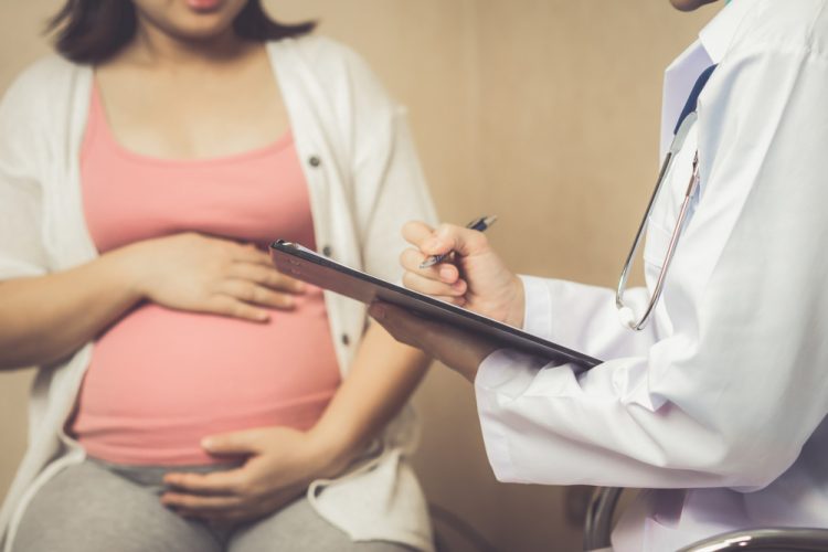 Happy,Pregnant,Woman,Visit,Gynecologist,Doctor,At,Hospital,Or,Medical Happy,Pregnant,Woman,Visit,Gynecologist,Doctor,At,Hospital,Or,Medical